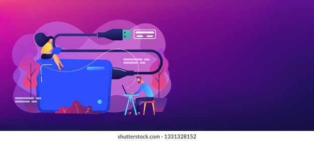 Tiny business people at laptops using portable external hard drive. External hard drive, data storage device, external storage hdd concept. Header or footer banner template with copy space.