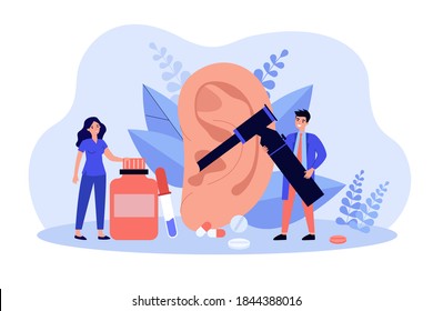 Tiny doctors making ear examination with tool isolated flat vector illustration. Cartoon medical characters treating hearing loss. Otology and otolaryngology concept