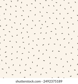 Tiny dog bone seamless vector pattern background. Neutral ditzy scattered canine food backdrop with bones. Ecru beige animal repeat for doggie and pet products. Small elements all over print