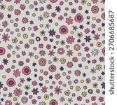 Tiny hand drawn flowers scattered across a soft background as a seamless vector pattern ideal for fabric and wrapping design.
