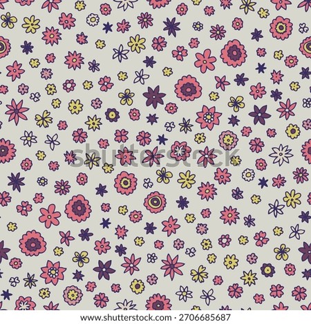 Tiny hand drawn flowers scattered across a soft background as a seamless vector pattern ideal for fabric and wrapping design.