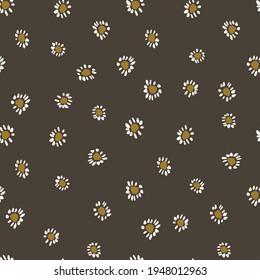 Tiny little daisies in white and yellow over a black background. Simple cute floral seamless vector pattern. Great for home decor, fabric, wallpaper, gift-wrap, stationery, etc.