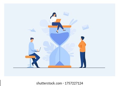 Tiny people and huge sand glass flat vector illustration. Cartoon team working together with laptops. Time management and business concept
