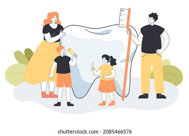 Tiny people standing near big tooth holding oral cavity care hygiene products. Happy family brushing molar with toothpaste and toothbrush flat vector illustration. Stomatology, dental health concept