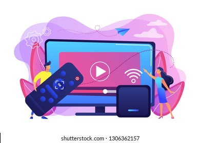 Tiny people watch video with remote control and television multimedia box. Smart TV box, smart tv console, make your TV smart concept. Bright vibrant violet vector isolated illustration