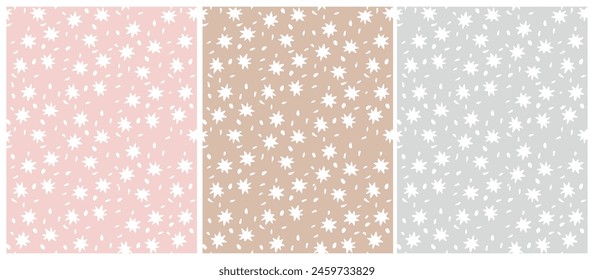 Tiny Stars Seamless Vector Patterns.Irregular Hand Drawn Simple Starry Print. Infantile Drawing Style Galaxy Design. Little Stars Isolated on a Light Gray, Cappuccino Brown and Pastel Pink.