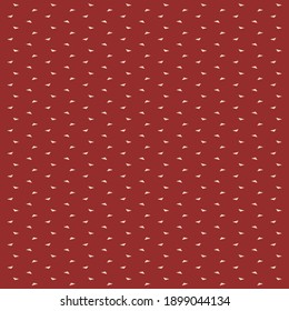 Tiny triangular patches on burgundy red background. Simple textile design.