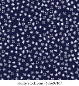 Tiny white flowers on a blue background. Seamless print for your textiles. Vintage ornament. Vector illustration.