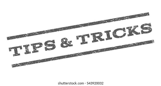 Tips & Tricks watermark stamp. Text tag between parallel lines with grunge design style. Rubber seal stamp with scratched texture. Vector grey color ink imprint on a white background.