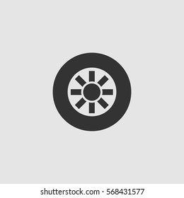 Tire icon flat. Black pictogram on grey background. Vector illustration symbol