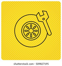 Tire service icon. Wheel and wrench key sign. Linear icon on orange background. Vector