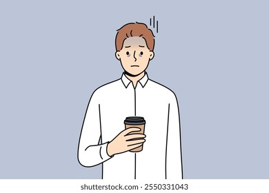 Tired business man suffering from exhaustion and burnout and holding paper cup of coffee in hands. Problems exhaustion among office employee experiencing health difficulties due to constant overtime