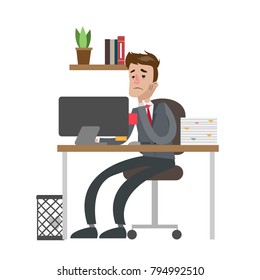 Tired businessman at office sitting at the table.