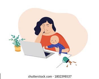 Tired mom trying to work, holding baby in her arms