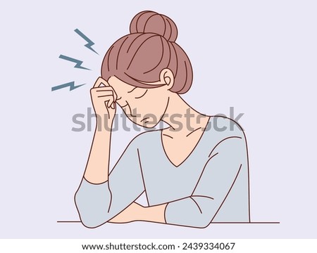 Tired, Sadness, mental depression, concept. Young unhappy woman sitting touching head and feeling depressed 