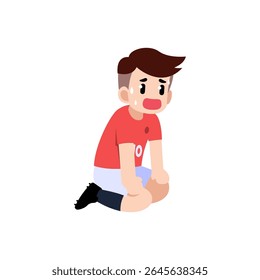 A tired soccer player sitting down