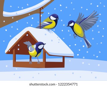 Tits in winter at the bird feeder. birds fly