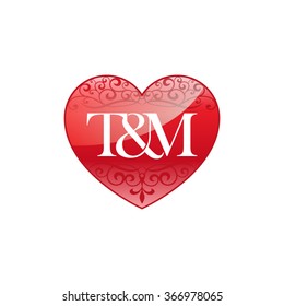 T&M initial letter logo with ornament heart shape