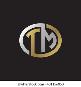 TM initial letters looping linked ellipse elegant logo golden silver black background