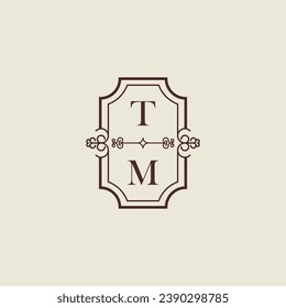 TM vintage wedding initial logo in high quality professional design that will print well across any print media