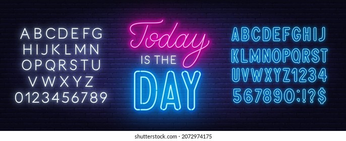 Today is the Day neon lettering on brick wall background.