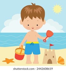 Toddler boy with sand bucket and scoop in hand on summer beach