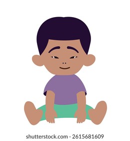 Toddler boy sitting on the ground