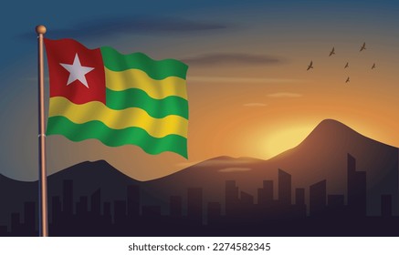 Togo flag with mountains and morning sun in the background