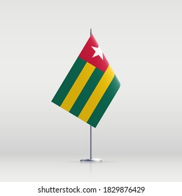 Togo flag state symbol isolated on background national banner. Greeting card National Independence Day of the Togolese republic. Illustration banner with realistic state flag.