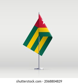 Togo flag state symbol isolated on background national banner. Greeting card National Independence Day of the Togolese republic. Illustration banner with realistic state flag.