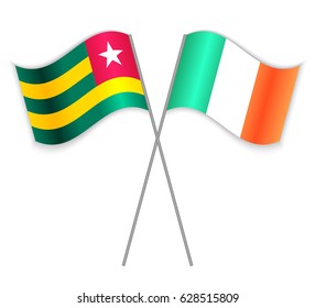 Togolese and Irish crossed flags. Togo combined with Ireland isolated on white. Language learning, international business or travel concept.