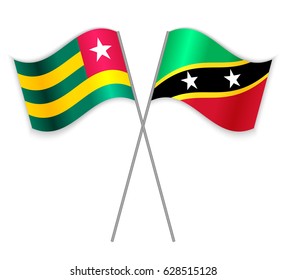 Togolese and Kittitian crossed flags. Togo combined with Saint Kitts and Nevis isolated on white. Language learning, international business or travel concept.