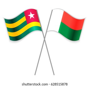 Togolese and Malagasy crossed flags. Togo combined with Madagascar isolated on white. Language learning, international business or travel concept.