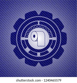 toilet paper icon inside badge with denim texture
