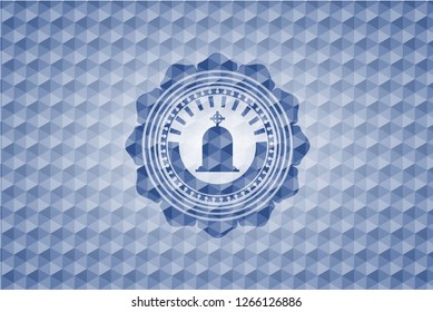 tombstone icon inside blue emblem or badge with geometric pattern background.