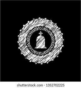 tombstone icon inside chalkboard emblem on black board