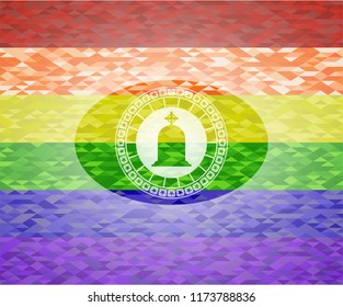 tombstone icon inside emblem on mosaic background with the colors of the LGBT flag