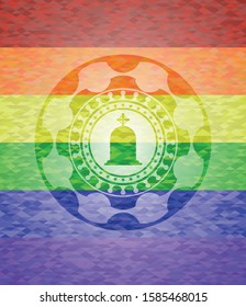 tombstone icon inside emblem on mosaic background with the colors of the LGBT flag