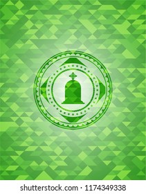 tombstone icon inside green emblem with mosaic background