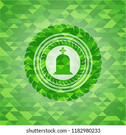 tombstone icon inside green mosaic emblem