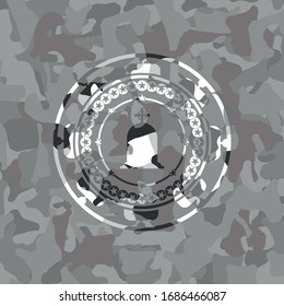 tombstone icon inside grey camouflaged emblem