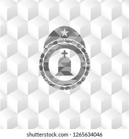 tombstone icon inside grey emblem with cube white background
