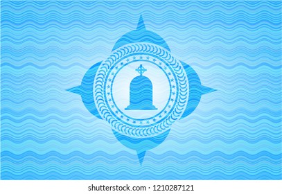 tombstone icon inside light blue water wave style emblem.