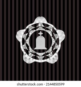 tombstone icon inside silver badge. 