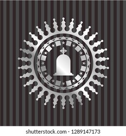 tombstone icon inside silvery emblem or badge