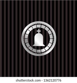 tombstone icon inside silvery emblem or badge