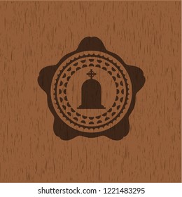 tombstone icon inside wood badge or emblem
