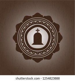 tombstone icon inside wood badge or emblem