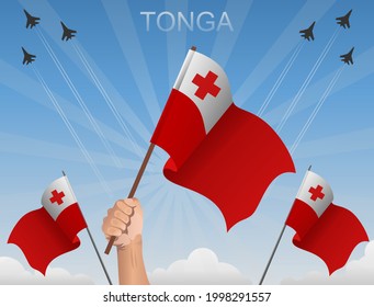Tongan flags flying under the blue sky