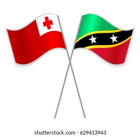 Tongan and Kittitian crossed flags. Tonga combined with Saint Kitts and Nevis isolated on white. Language learning, international business or travel concept.